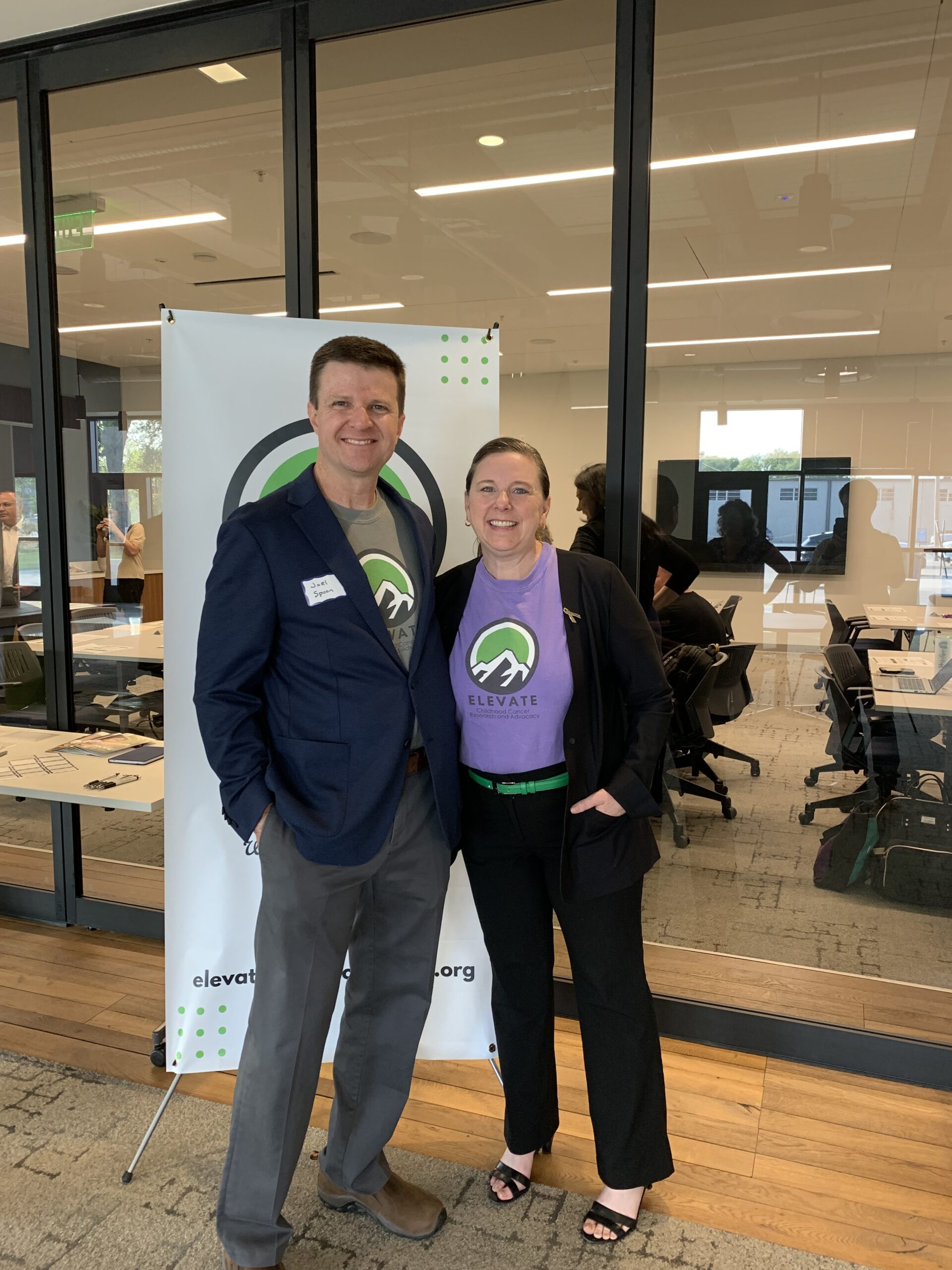 Robyn and Joel Spoon. Elevate Childhood Cancer Research and Advocacy t-shirts.